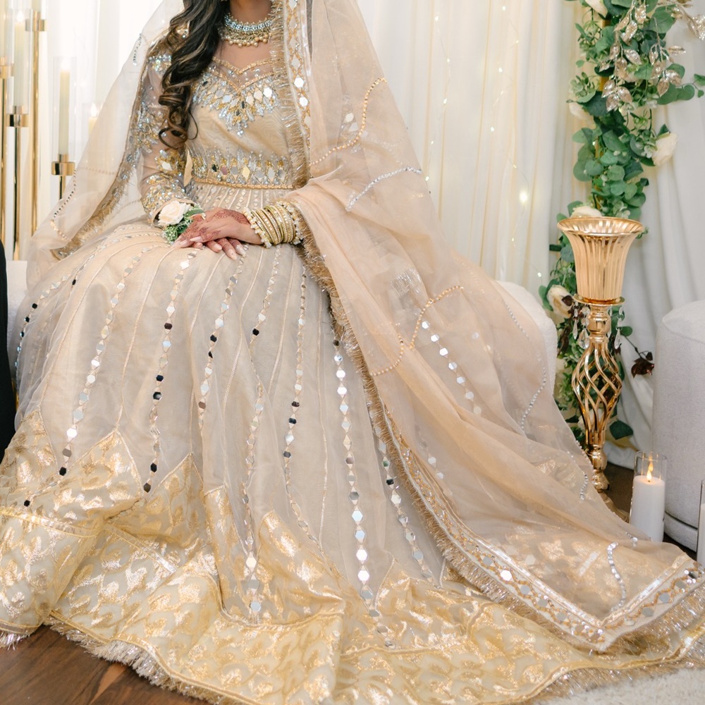 Pakistani Bridal Lehenga - Cream and Gold color